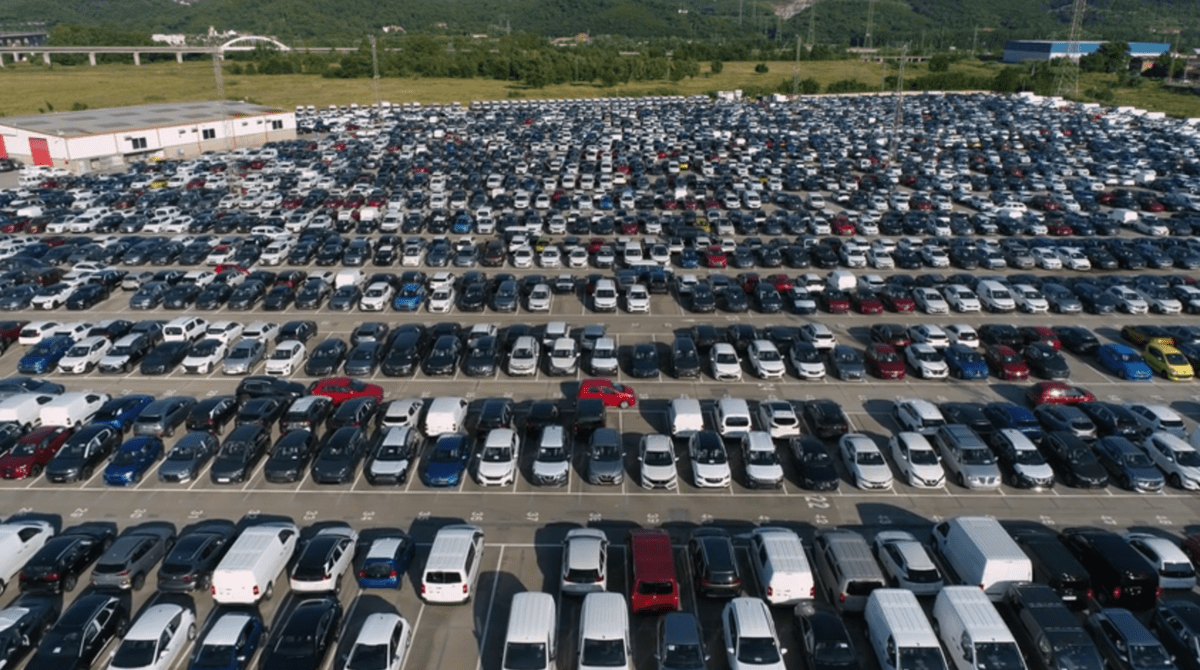 Parking Lot A high angle shot of a large, busy parking lot with hundreds of cars
