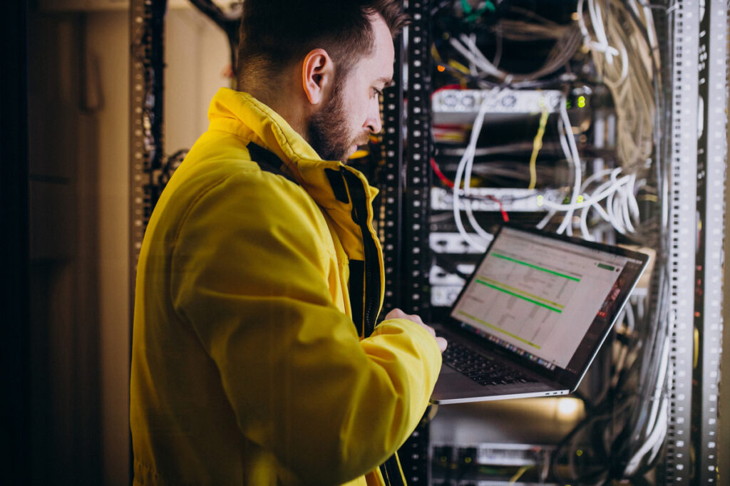 A network engineer configuring an ALPR system used in an ultimate guide to ALPR implementation and also an article on ALPR labor costs