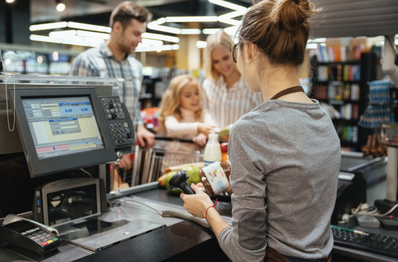 Gas-station-convenience-store-shopping A convenience store employee handling the billing for customers