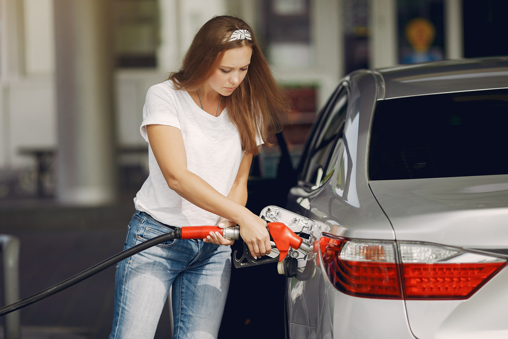 Gas-station-lady-filling-up A lady filling up at a gas station
