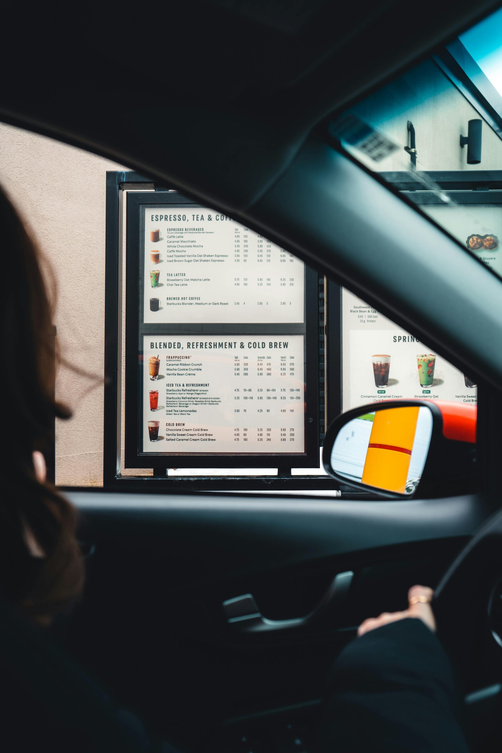 Drive through customer looking at the menu A drive-through customer looking at the restaurant menu