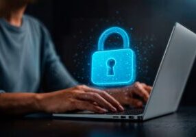 An illustration showing a digital lock hovering over a laptop to indicate data privacy